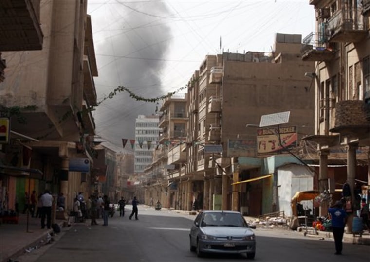 Smoke rises over central Baghdad, Iraq, on Sunday, following a series of explosions. 
